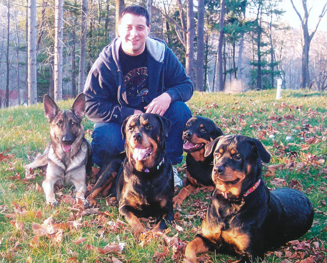 Owner Tony Mercuri poses with his 3 Rottweilers and German Shepherd